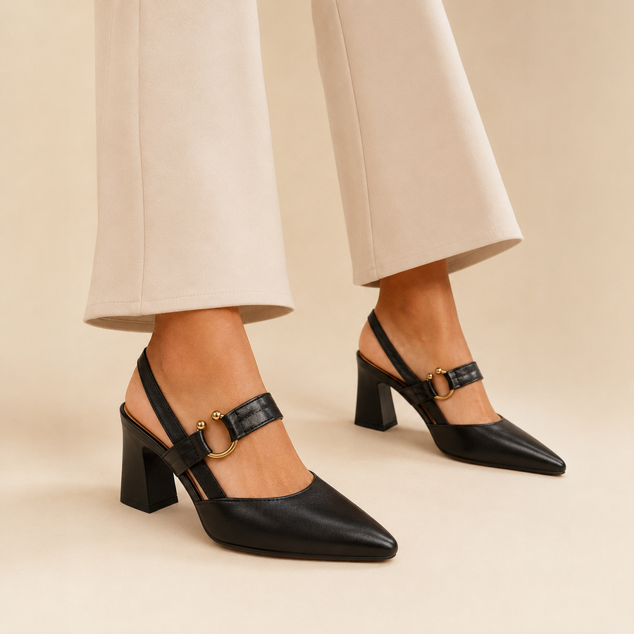 Model wearing black buckle slingback pumps