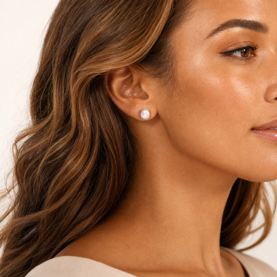 Model wearing freshwater cultured pearl stud earrings